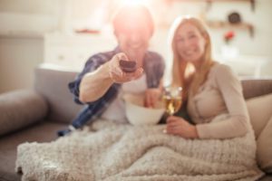 Mature couple watching television